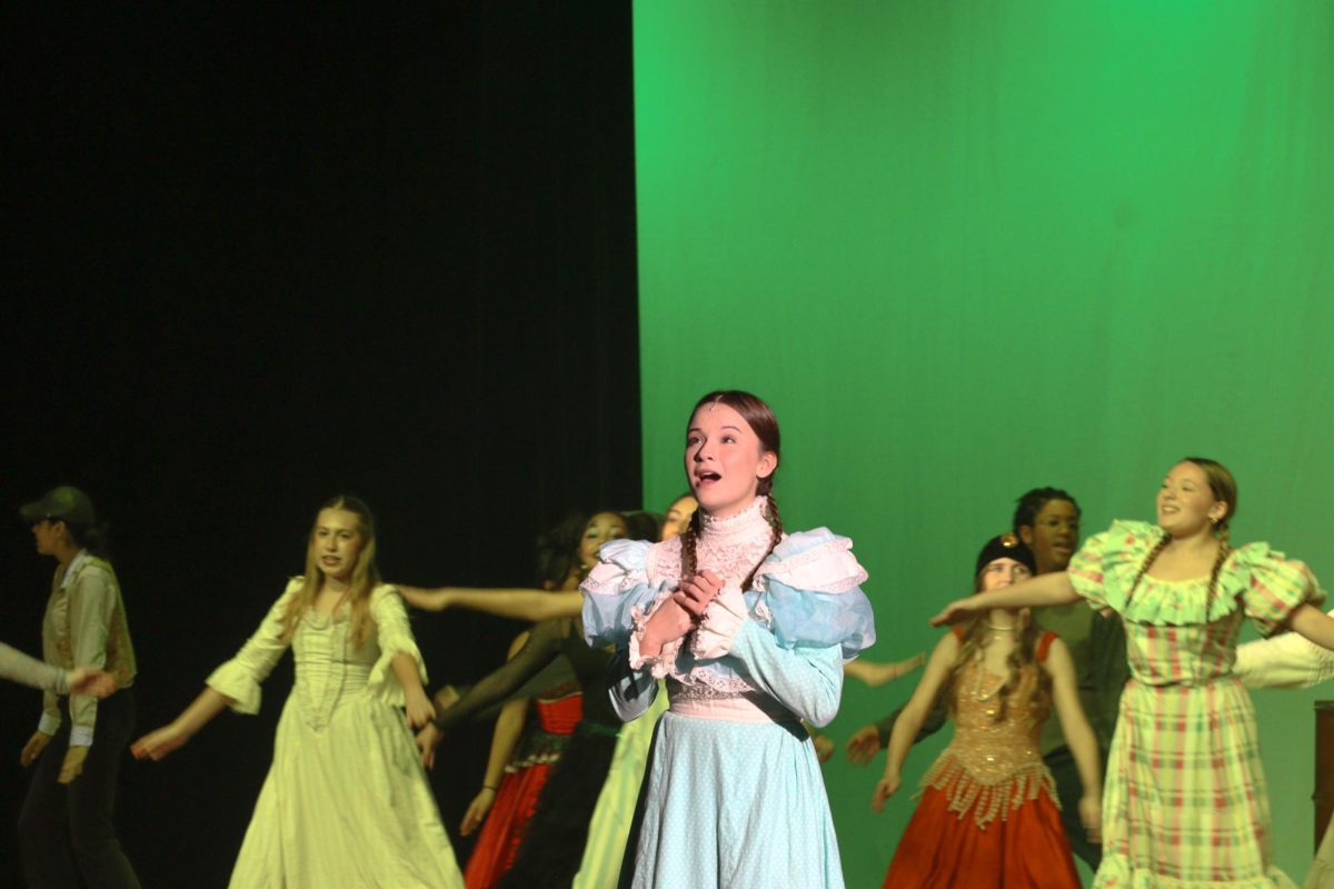 Senior Nola Cowles sings in the musical "Tuck Everlasting."