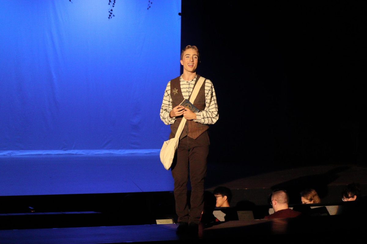 Junior Kaleb Paulson sings as the detective in training in "Tuck Everlasting" musical.