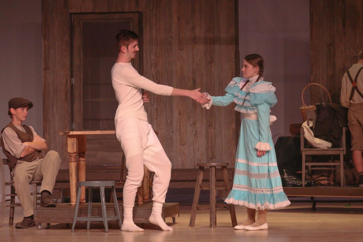 Nola Cowles and Christian Venditte shake hands in "Tuck Everlasting."