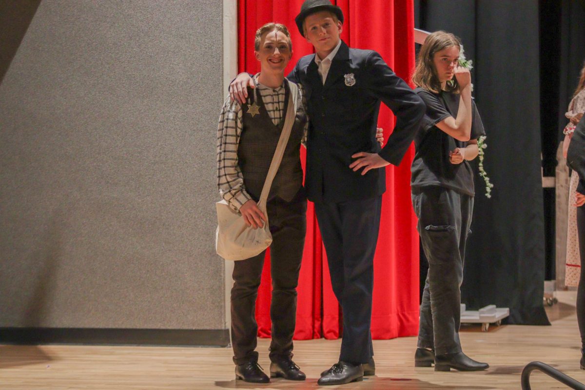 Juniors Kaleb Paulson and Blake Warren prepare for the final rehearsal of "Tuck Everlasting."