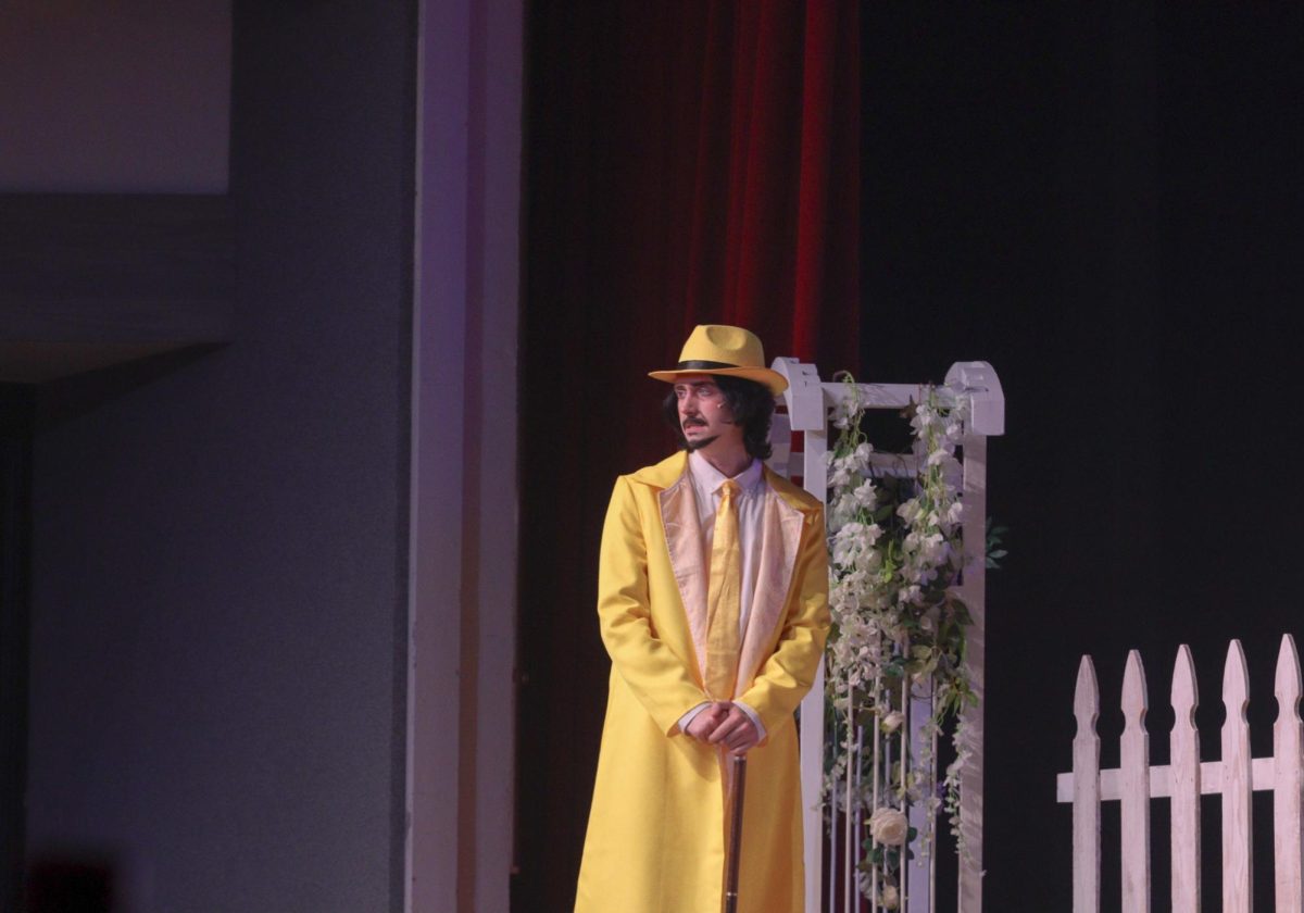 Senior Taylor Kohn as the "man in the yellow suit" in "Tuck Everlasting."