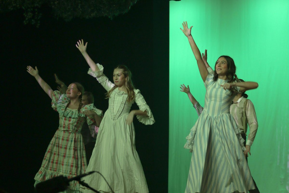 Ensemble members dance in the musical "Tuck Everlasting."