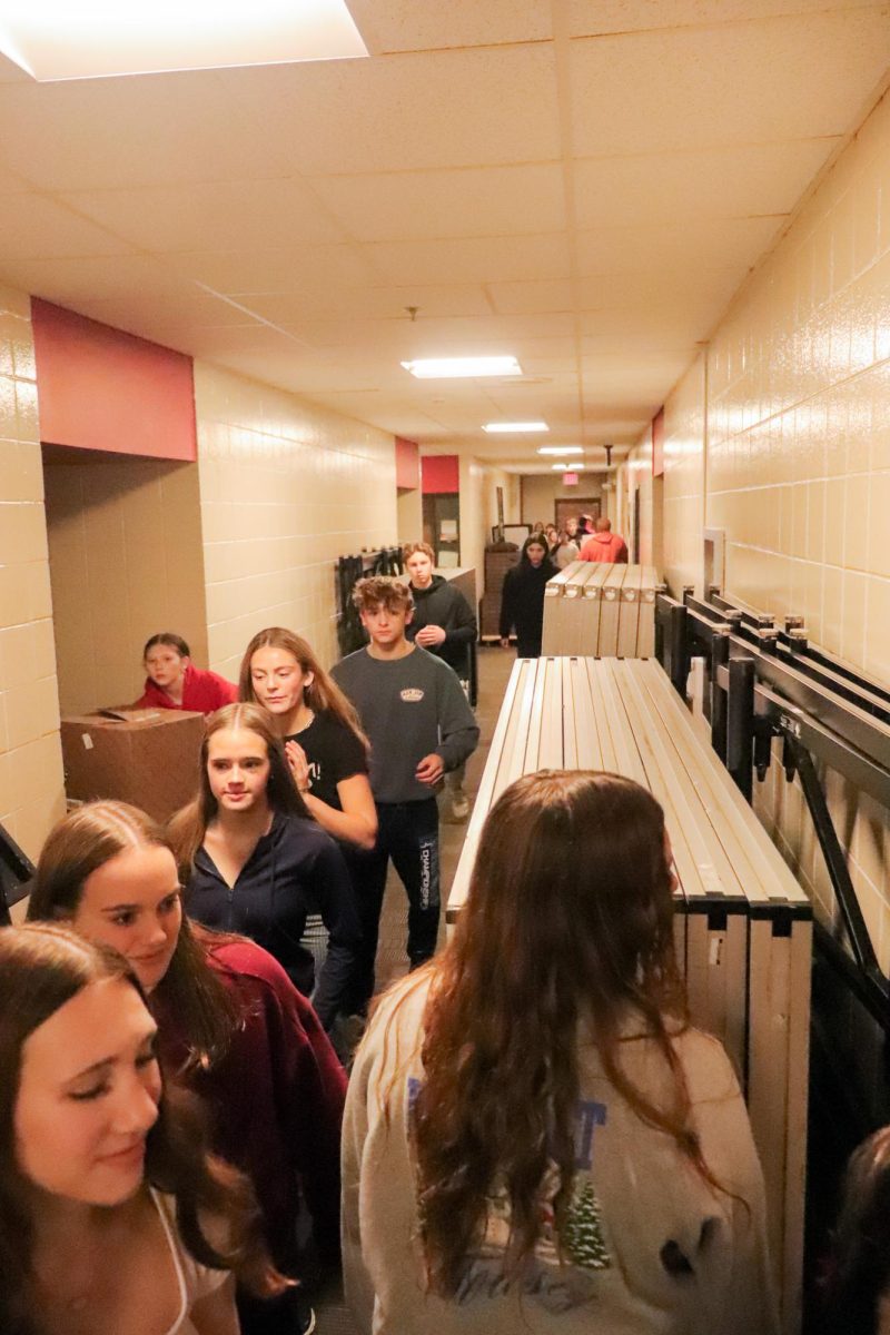 The line to unload all of the food and put them in the trucks in the 2025 food drive.