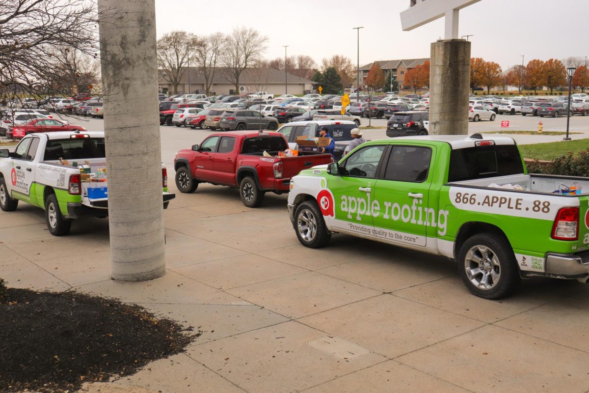 Four of the five trucks that carried the food from the 2025 food drive