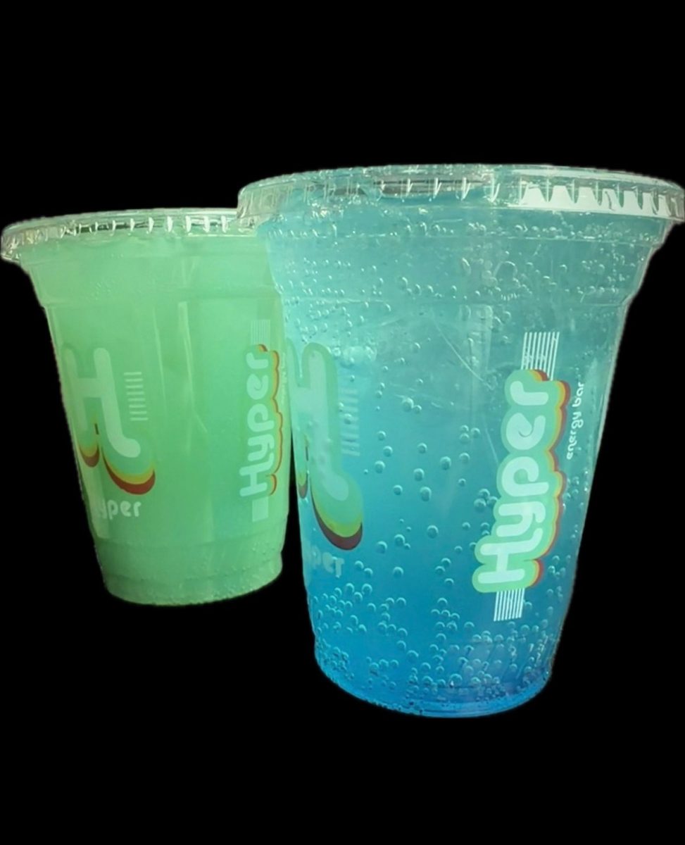 Two Hyper- infused energy drinks from Hyper. Pictured to the left, "Triple Threat", pictured to the right "Adrenaline Junkie". Taken on December 12, 2025.