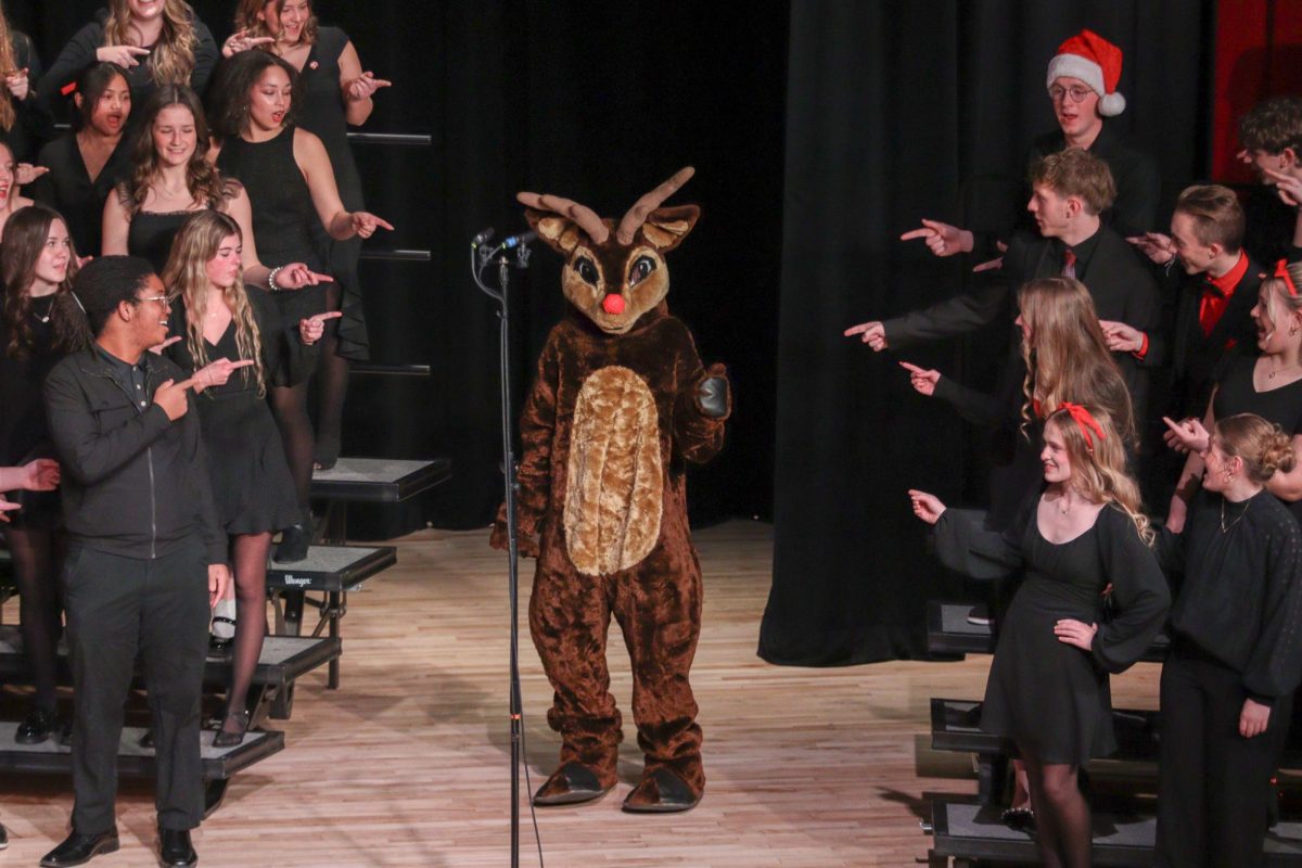 Andy the Antler making an appearance at the band and choir concert during the song "Rudolph the Red Nosed Reindeer".