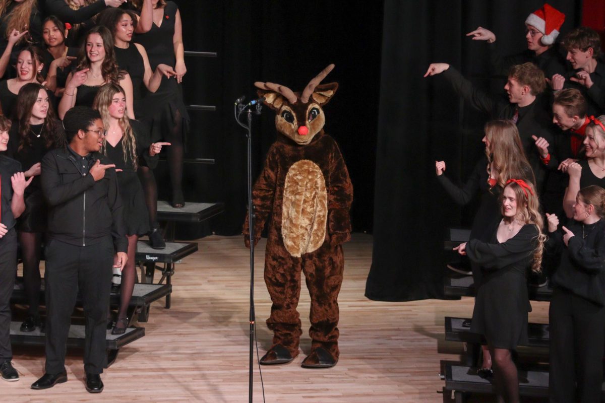 Andy the Antler making an appearance at the band and choir concert during the song "Rudolph the Red Nosed Reindeer".