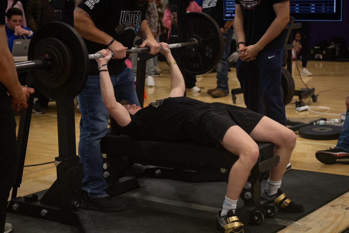 Zach Hammes, a junior from Elkhorn North, recieves a liftoff for his bench of 210 pounds at State Powerlifting on February 21, 2026.