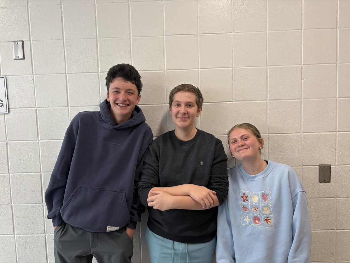 Cooper Hart, Pierce Lundgren, and Eliza Underwood pose outside the senior balcony. They are best friends and spend a lot of time together.