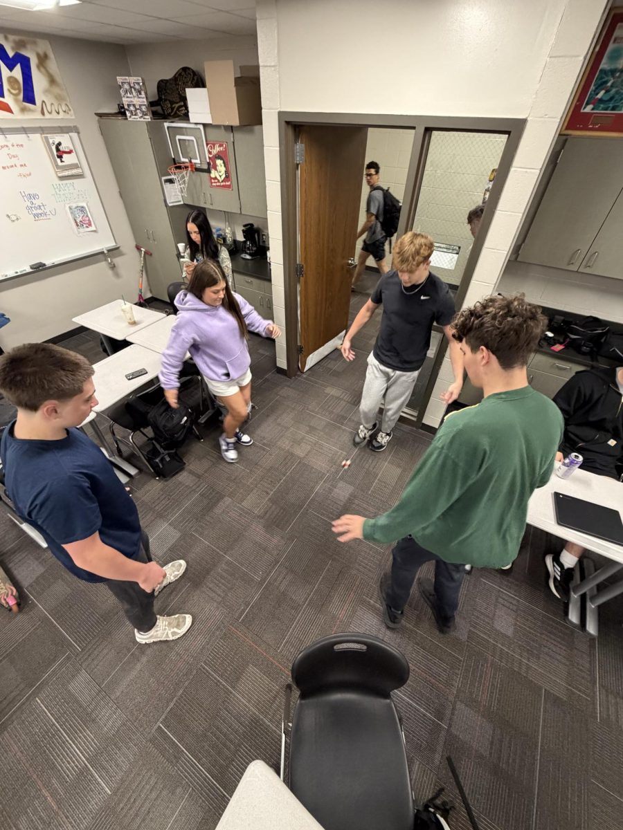 Seniors play hacky sack before class begins. Students say it is a fun way to bond with classmates.