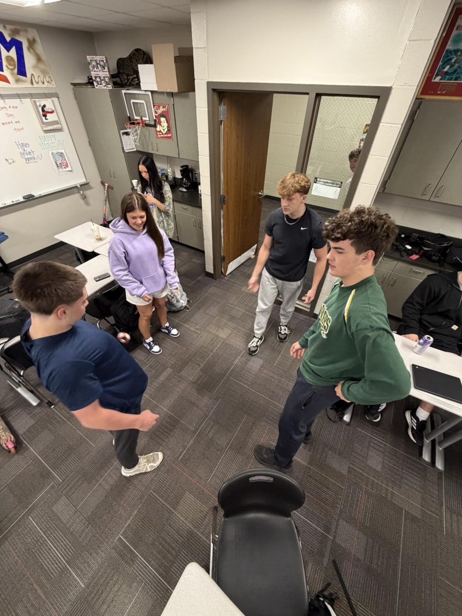 Seniors play hacky sack before class begins. Students say it is a fun way to bond with classmates.