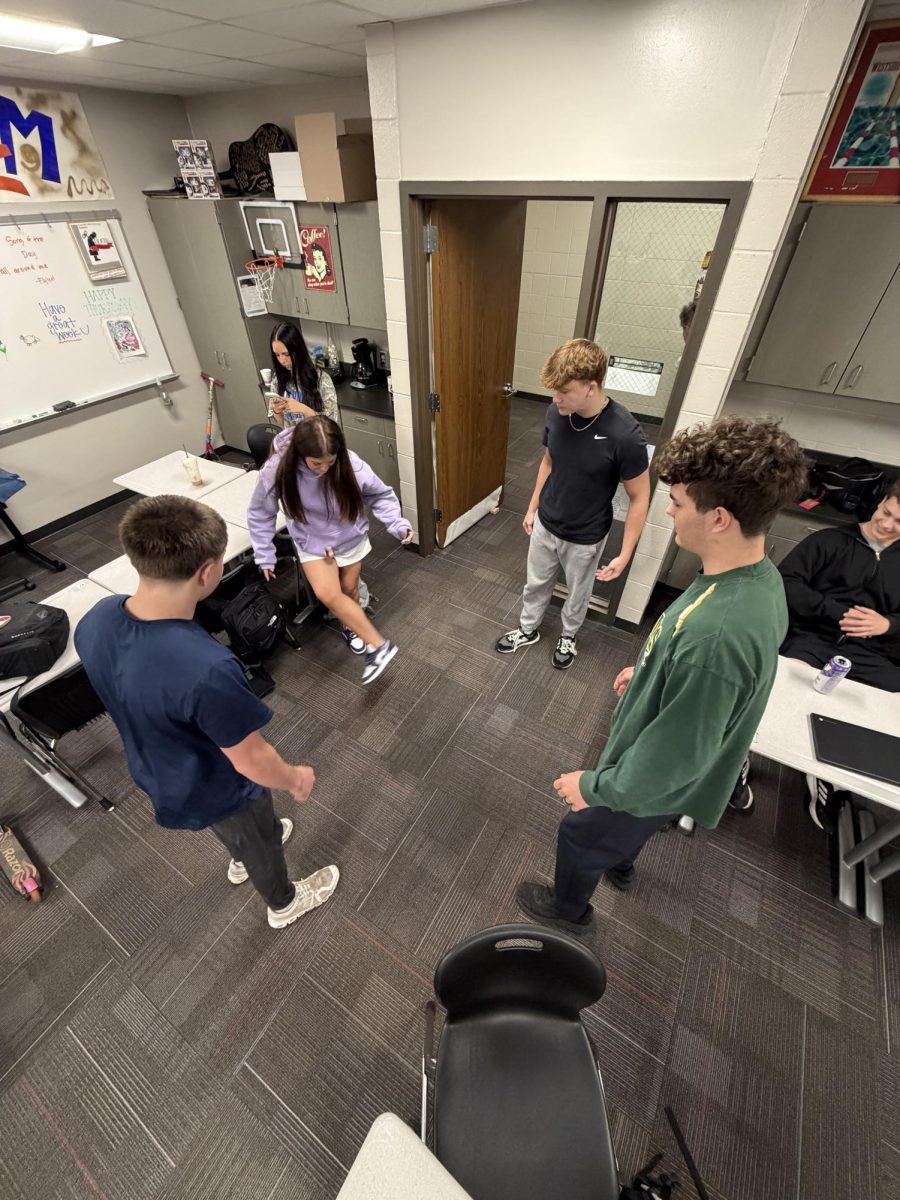 Seniors play hacky sack before class begins. Students say it is a fun way to bond with classmates.