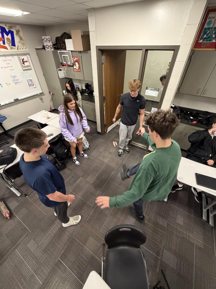 Seniors play hacky sack before class starts. Students say it's a fun way to bond with classmates.