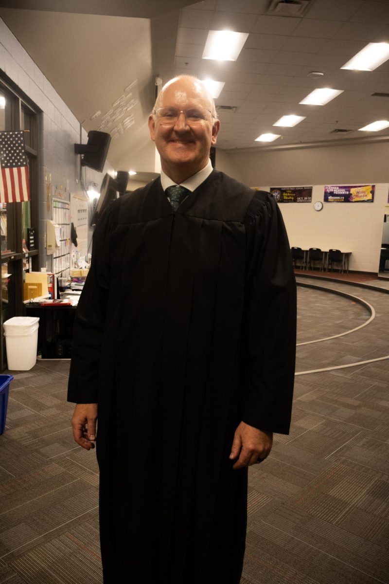 Justice Bergevin poses for a picture before he goes on stage to hear cases in the EHS auditorium.