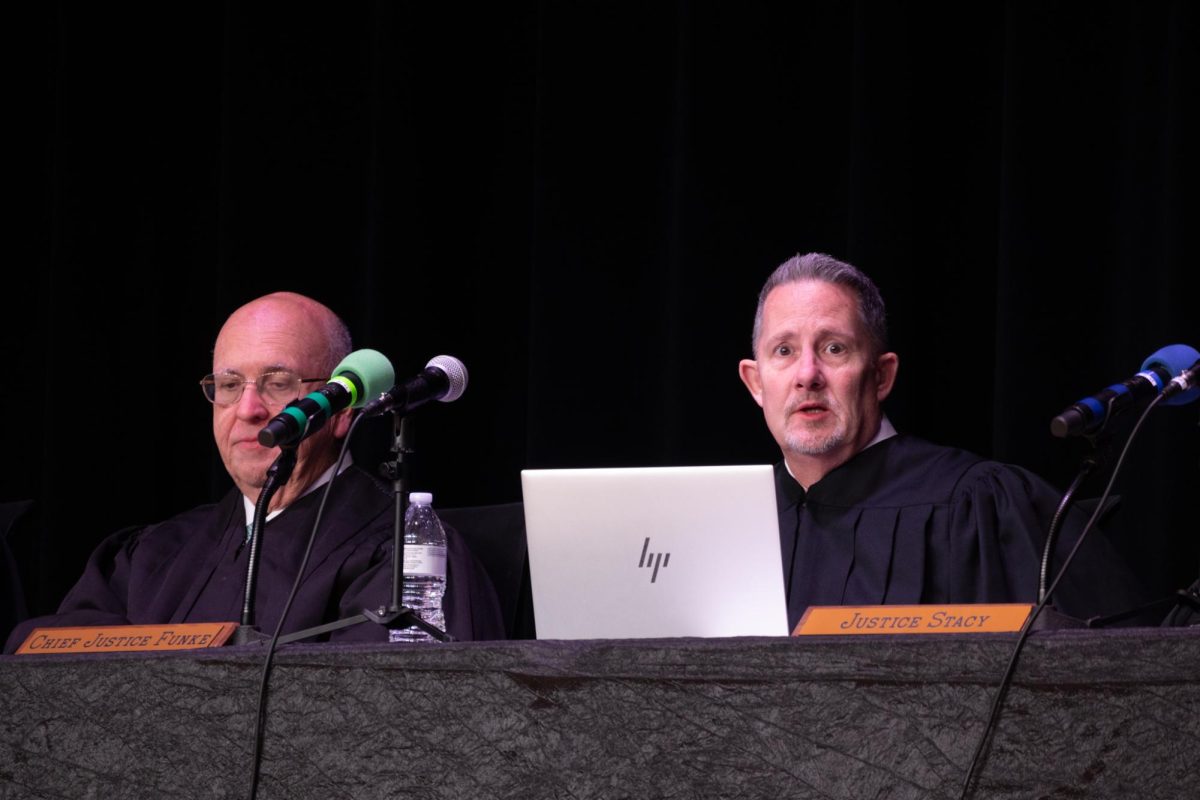 Justice Cassel and Chief Justice Funke respond to a student's question during the Q and A session following the case hearings at EHS.