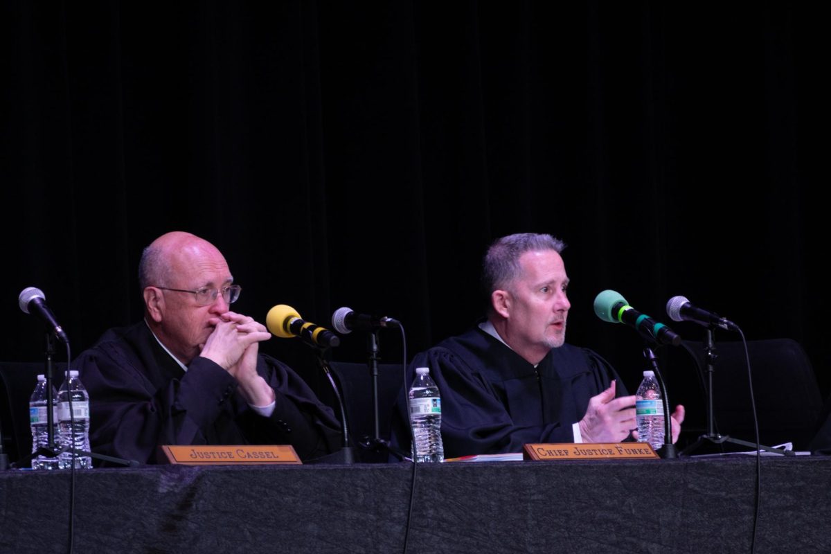 Justice Cassel and Chief Justice Funke respond to a student's question during the Q and A session following the case hearings at EHS.