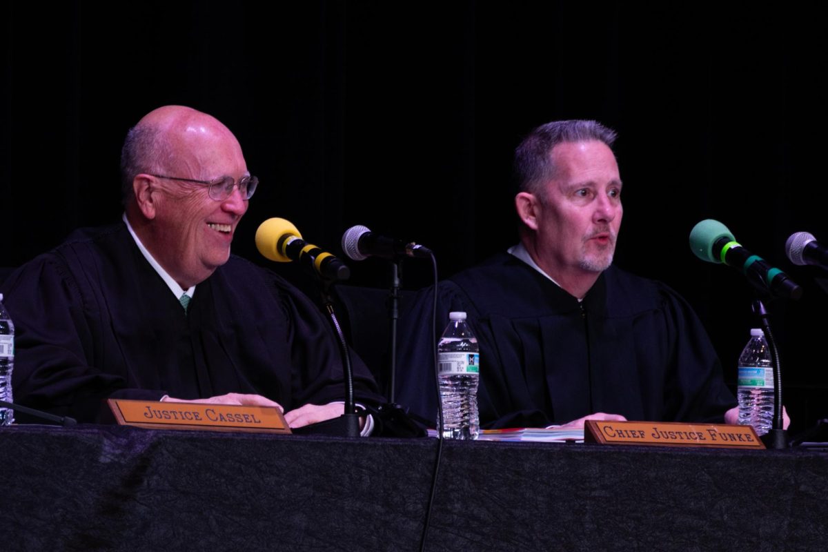 Justice Cassel and Chief Justice Funke respond to a student's question during the Q and A session following the case hearings at EHS.