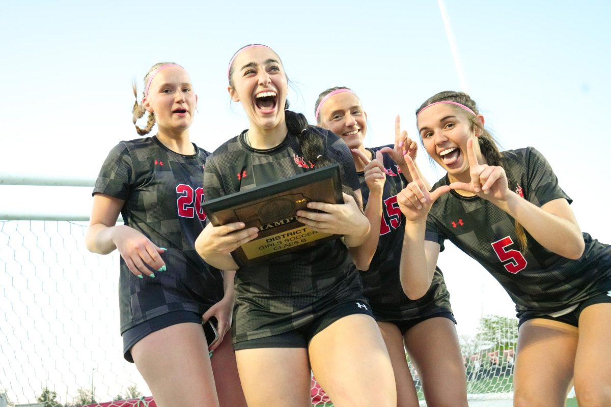 Antlers celebrating with the plaque after winning the district championship. 