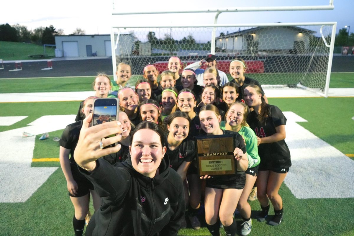 Antlers take a team picture after winning the district championship game. 