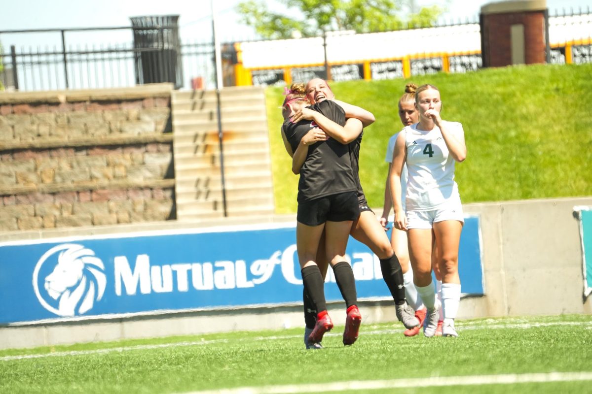 Freshman, Elly Thompson, celebrating with her teammate after scoring a goal in the state tournament. 
