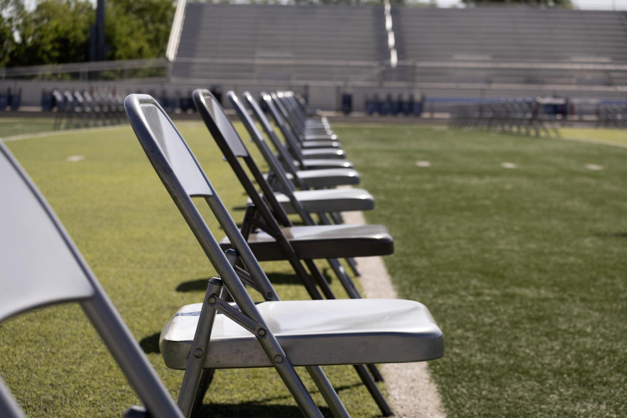 Chairs are set up in a grid pattern for graduation Sunday May 17. There is a possibility it will be moved inside due to weather.