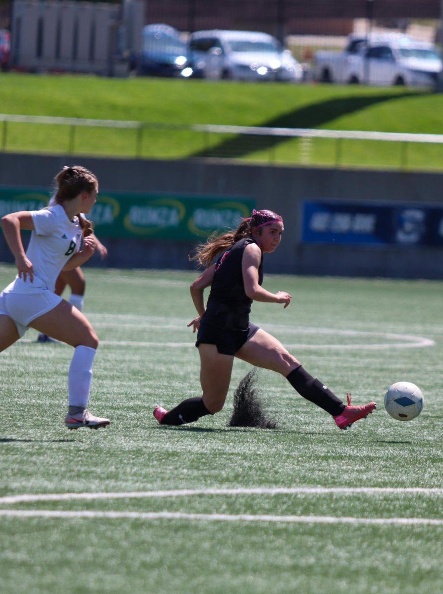 Junior Molly Flynn takes a shot on goal in the state tournament first-round game against Kearney Catholic. Flynn scored twice in the Antlers 5-0 win.