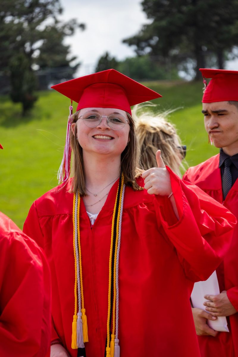 Senior Lily Lowther posing at EHS graduation ceremony.